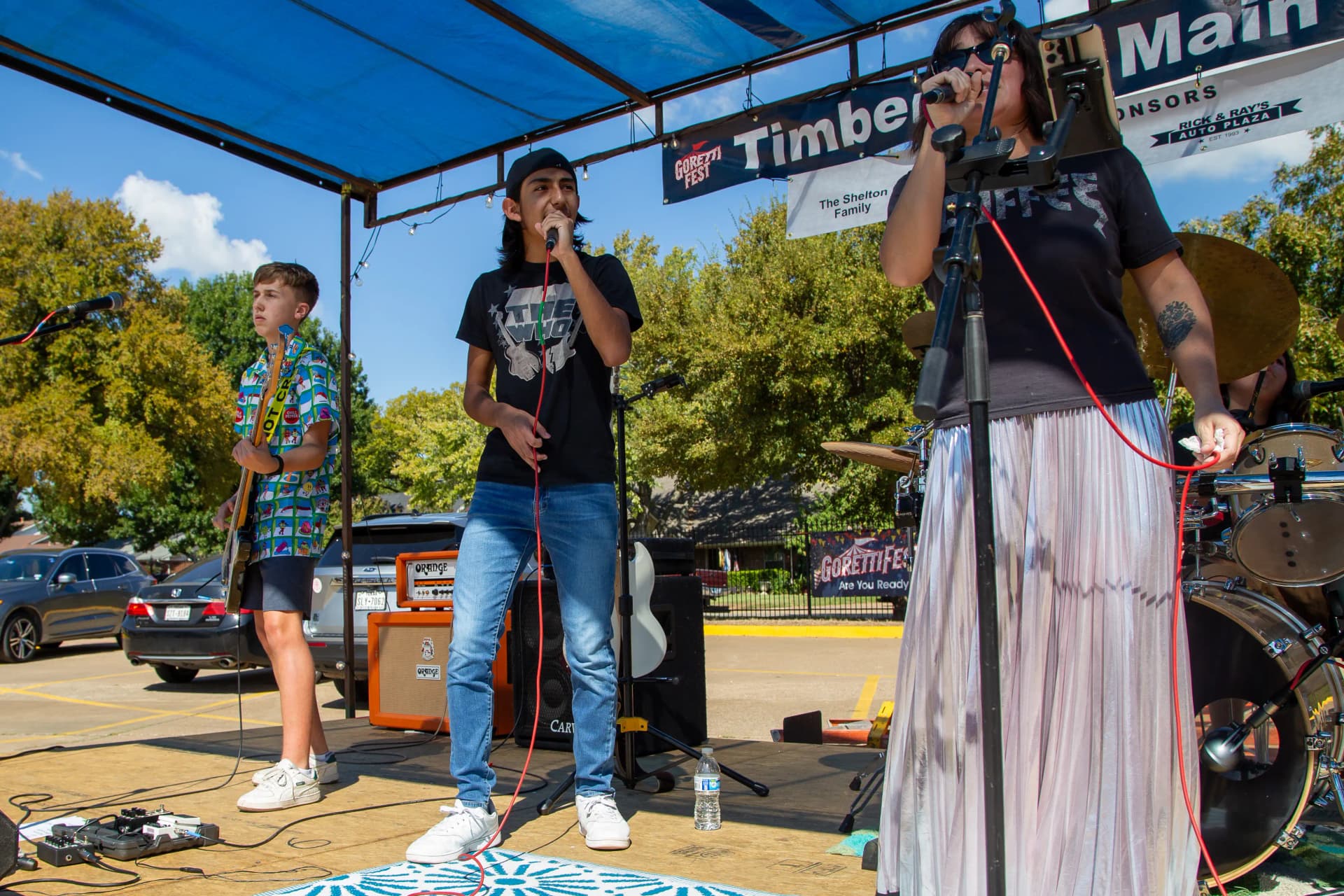 An alumni band playing rock music on stage at GorettiFest